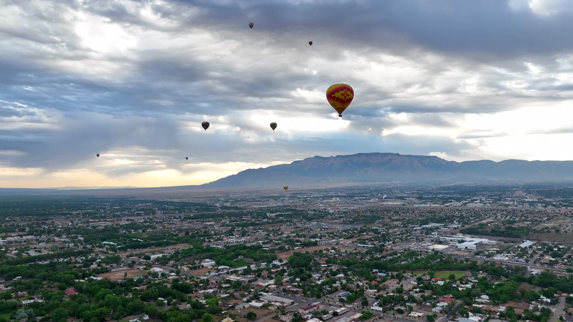 Hot air balloons over Albuquerque and the Sandia Mountains
